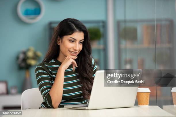 single young women. stock photo - woman laptop stock pictures, royalty-free photos & images