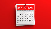 Pinned white and red-colored January 2022 calendar page.
