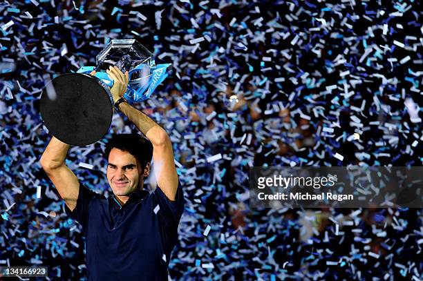 Roger Federer of Switzerland lifts the trophy following his victory during the men's final singles match against Jo-Wilfried Tsonga of France during...