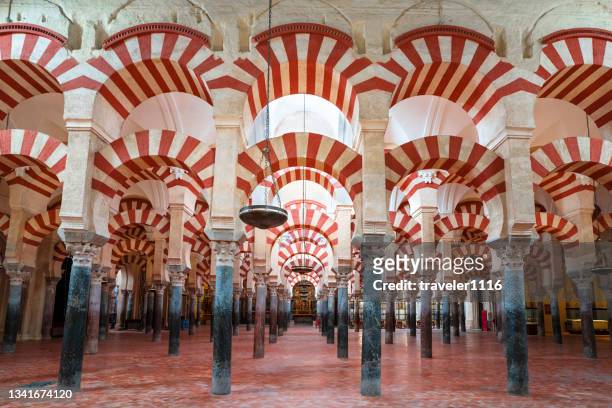 the famous arches of the mosque-cathedral of cordoba, spain. - córdoba spanien bildbanksfoton och bilder