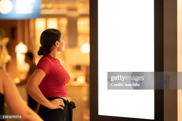 young woman is shopping for home at furnishings store. - shopping screen stockfoto's en -beelden