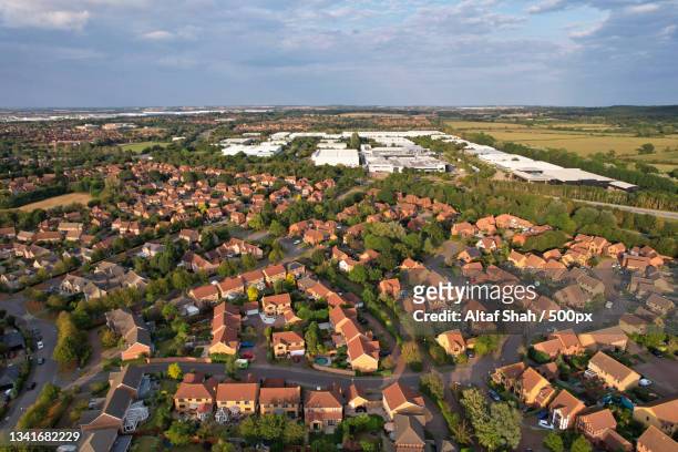 high angle view of townscape against sky,caldecotte lake,milton keynes,united kingdom,uk - milton keynes stock pictures, royalty-free photos & images