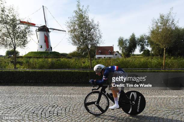 Romain Gregoire of France sprints in front of a windmill in Damar City during the 94th UCI Road World Championships 2021 - Men Junior ITT a 22,3km...