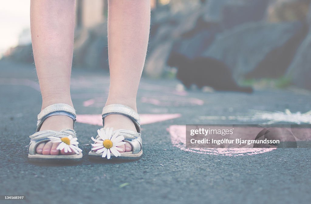 Flowers on toes of woman's shoes