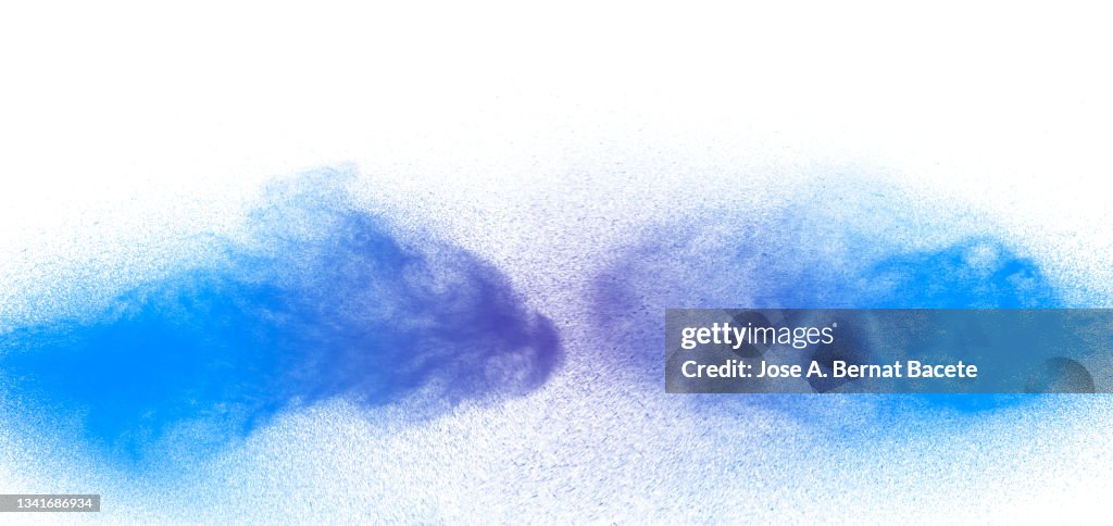 Shock of jets and drops of blue paint on a white background.