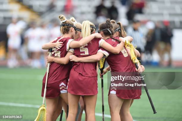 The Boston College Eagles huddle against the Syracuse Orange during the Division I Women’s Lacrosse Championship held at Johnny Unitas Stadium on May...