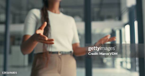 cropped shot of an unrecognizable woman making hands gestures while having a conversation in a modern office - woman making a deal stock pictures, royalty-free photos & images