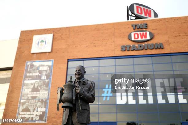 General view outside of the stadium displaying a statue of Dave Whelan ahead of the Carabao Cup Third Round match between Wigan Athletic and...