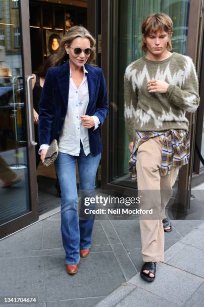 Kate Moss and Jordan Barrett leaving Richard Quinn fashion show at The Londoner Hotel during London Fashion Week September 2021 on September 21, 2021...