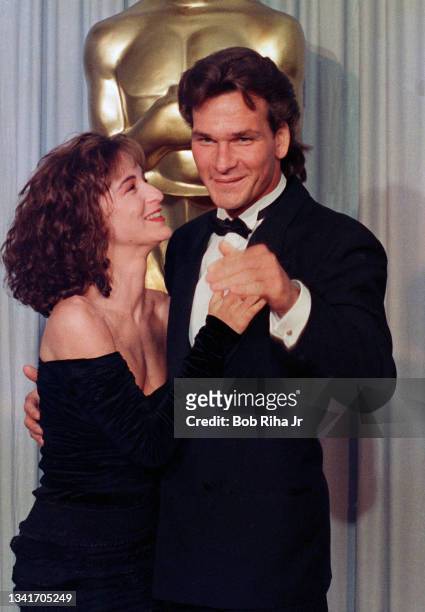 Jennifer Grey and Patrick Swayze backstage at the Academy Awards, April 11, 1988 in Los Angeles, California.