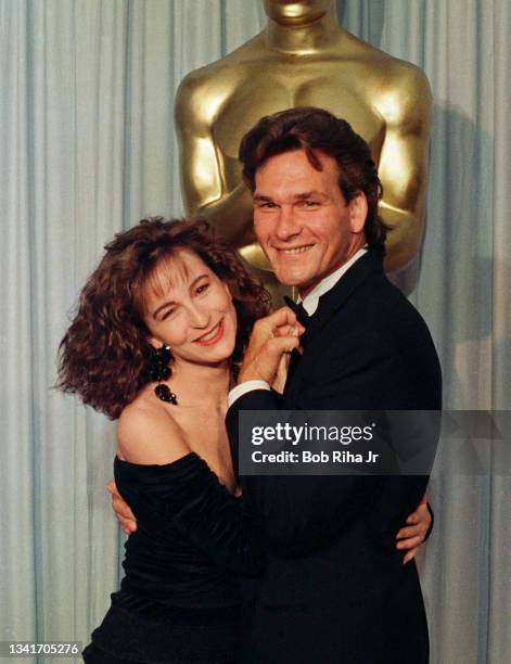 Jennifer Grey and Patrick Swayze backstage at the Academy Awards, April 11, 1988 in Los Angeles, California.