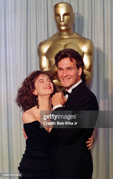 Jennifer Grey and Patrick Swayze backstage at the Academy Awards, April 11, 1988 in Los Angeles, California.