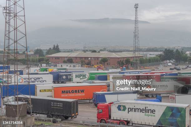 trailers and trucks queued to board a ferry to cross the irish sea - brexit stock pictures, royalty-free photos & images