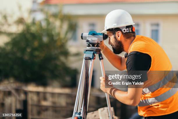 construction worker working in construction site - inspector imagens e fotografias de stock