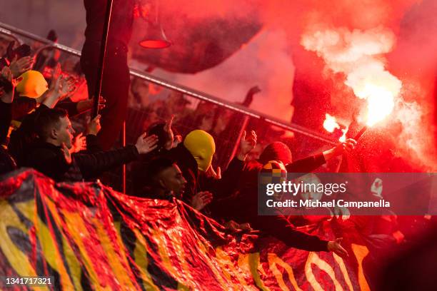 Supporters light flares during the Allsvenskan match between AIK and IFK Goteborg at Friends Arena on August 20, 2021 in Stockholm, Sweden.