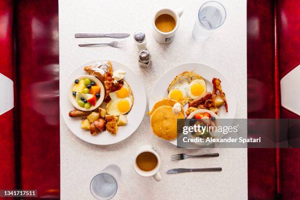 breakfast at the traditional american diner, directly above view - diner plates stock pictures, royalty-free photos & images