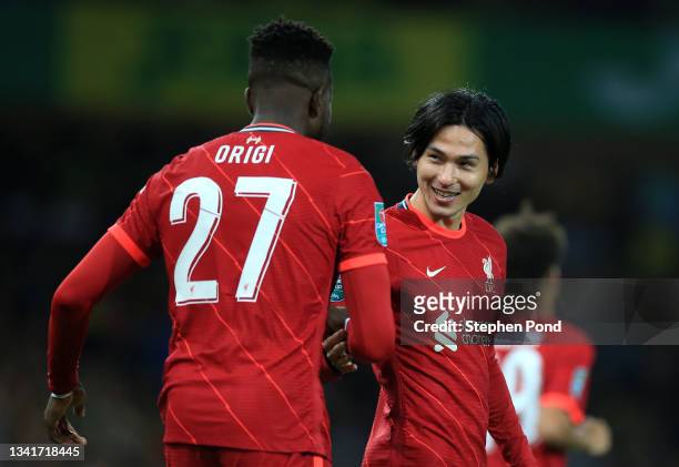 Takumi Minamino of Liverpool celebrates after scoring their sides first goal with team mate Divock Origi during the Carabao Cup Third Round match...
