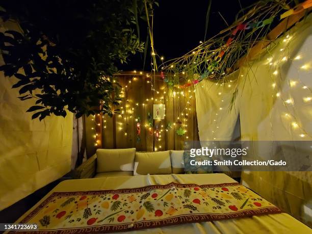 Night view of sukkah or ritual outdoor hut for the Jewish holiday of Sukkot, Lafayette, California, September 20, 2021.