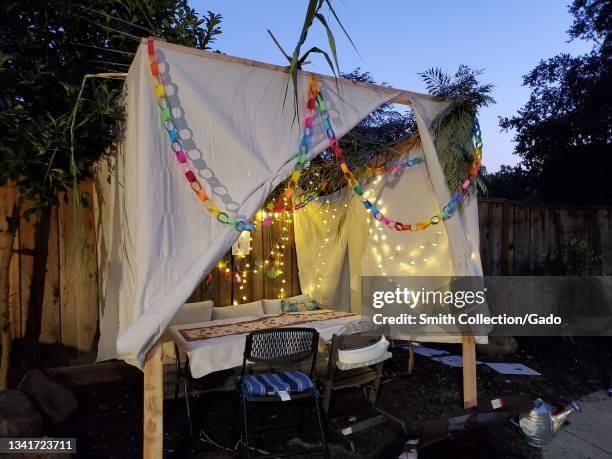 Night view of sukkah or ritual outdoor hut for the Jewish holiday of Sukkot, Lafayette, California, September 20, 2021.