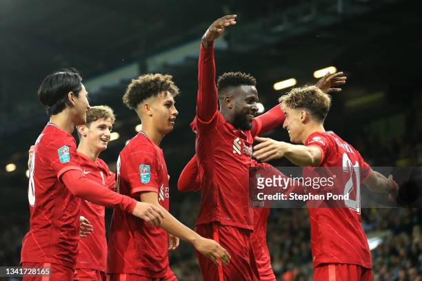 Divock Origi of Liverpool celebrates after scoring their sides second goal with team mate Kostas Tsimikas during the Carabao Cup Third Round match...