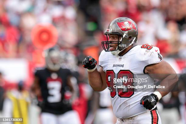 Ndamukong Suh of the Tampa Bay Buccaneers reacts after sacking Matt Ryan of the Atlanta Falcons during the first half at Raymond James Stadium on...