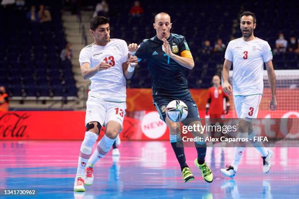 Leandro Cuzzolino of Argentina battles for possession with Farhad Tavakoli of IR Iran during the FIFA Futsal World Cup 2021 group F match between IR...