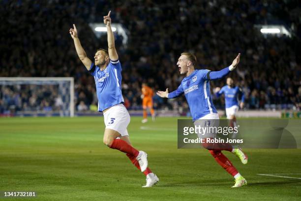 Lee Brown of Portsmouth FC celebrates after he scores a goal to make it 1-0 with team-mate Ronan Curtis during the Sky Bet League One match between...