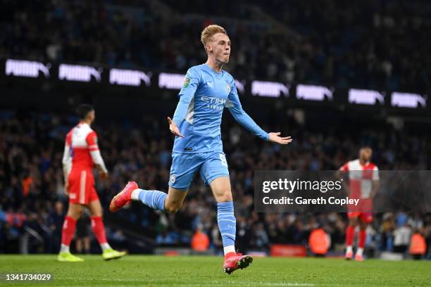 Cole Palmer of Manchester City celebrates after scoring their sides sixth goal during the Carabao Cup Third Round match between Manchester City and...