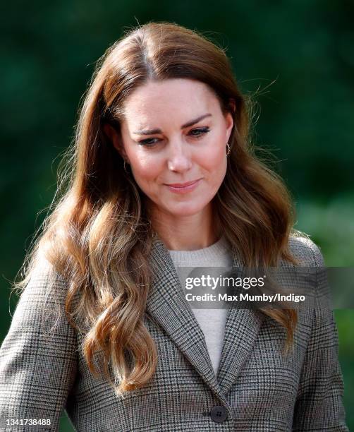 Catherine, Duchess of Cambridge arrives to embark on a boat trip, on Lake Windermere, with two of the 'Windermere Children', a group of 300 child...
