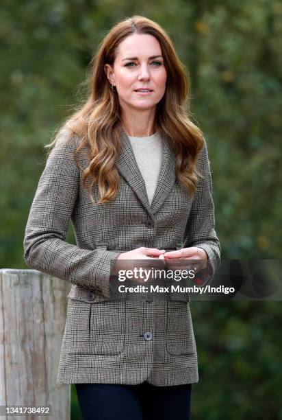 Catherine, Duchess of Cambridge arrives to embark on a boat trip, on Lake Windermere, with two of the 'Windermere Children', a group of 300 child...