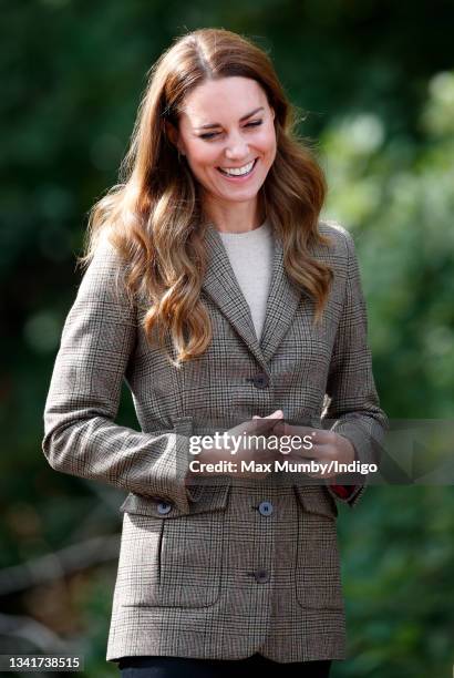 Catherine, Duchess of Cambridge arrives to embark on a boat trip, on Lake Windermere, with two of the 'Windermere Children', a group of 300 child...