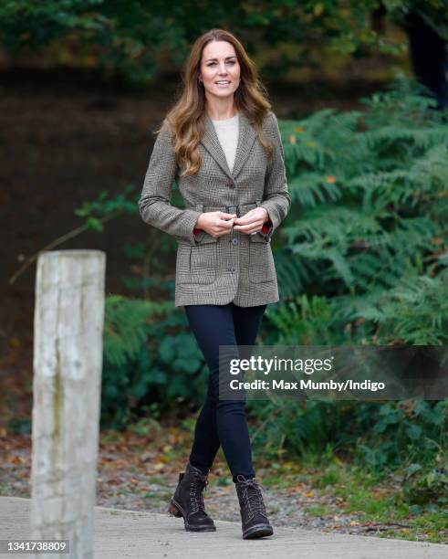 Catherine, Duchess of Cambridge arrives to embark on a boat trip, on Lake Windermere, with two of the 'Windermere Children', a group of 300 child...