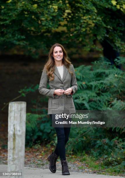 Catherine, Duchess of Cambridge arrives to embark on a boat trip, on Lake Windermere, with two of the 'Windermere Children', a group of 300 child...