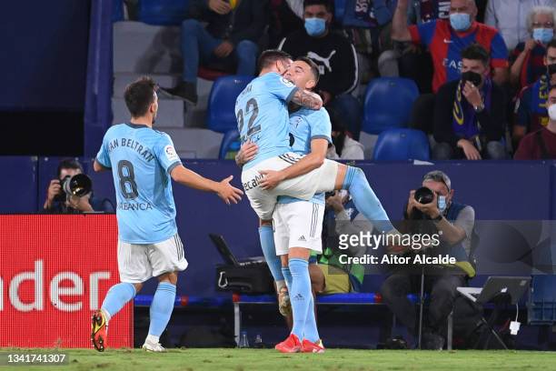 Iago Aspas of Celta Vigo celebrates with Santi Mina and Fran Beltran after scoring their sides first goal during the La Liga Santander match between...