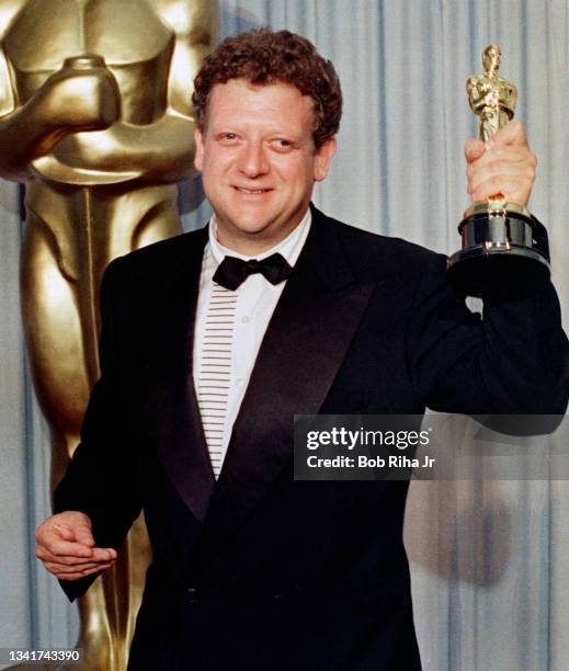 Best Picture winner for 'The Last Emperor' Producer Jeremy Thomas celebrates backstage at the Academy Awards, April 11, 1988 in Los Angeles,...