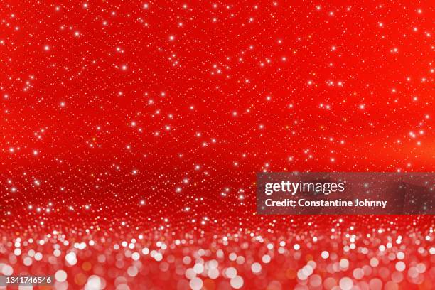 christmas red background - glittering snow stock pictures, royalty-free photos & images