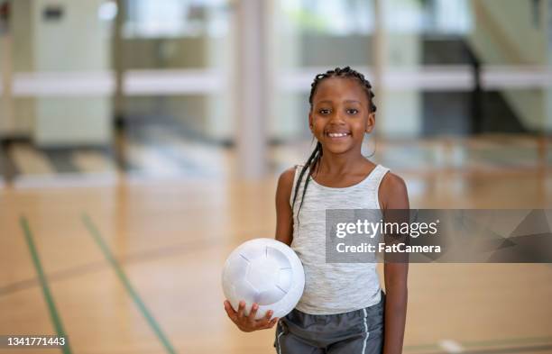 elementary student during gym class - girls volleyball stock pictures, royalty-free photos & images