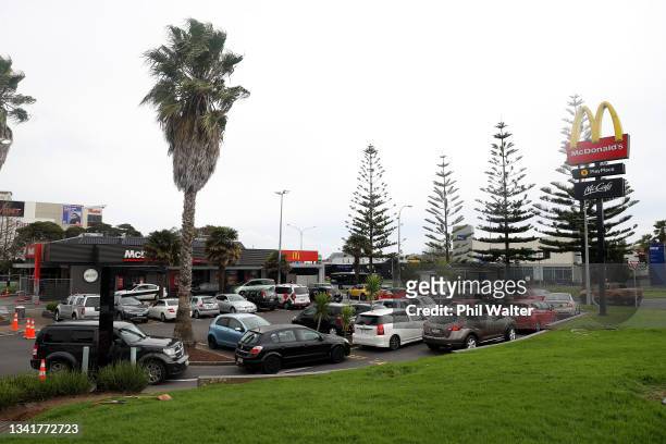 Large queue of cars line up for the McDonalds drive through in Manukau on September 22, 2021 in Auckland, New Zealand. Restrictions have eased for...