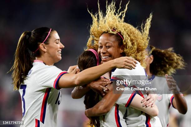 Rose Lavelle of the United States celebrates her goal in the first half with teammates Alex Morgan and Casey Krueger during a Women's International...