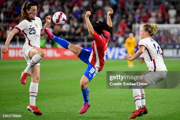 Fanny Godoy of Paraguay controls the ball against Andi Sullivan and Emily Sonnett of the United States in the first half during a Women's...