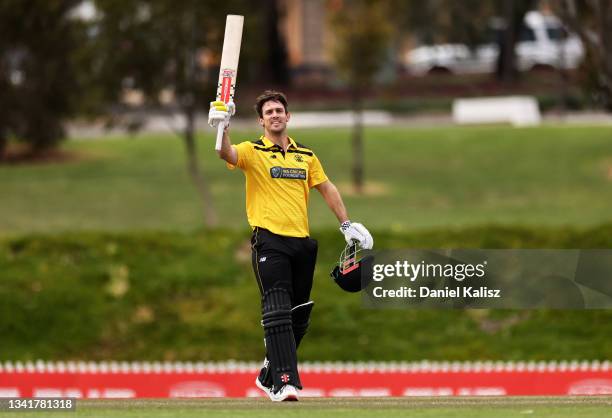 Mitchell Marsh of Western Australia celebrates after reaching his century during the Marsh One-Day Cup match between South Australia and Western...