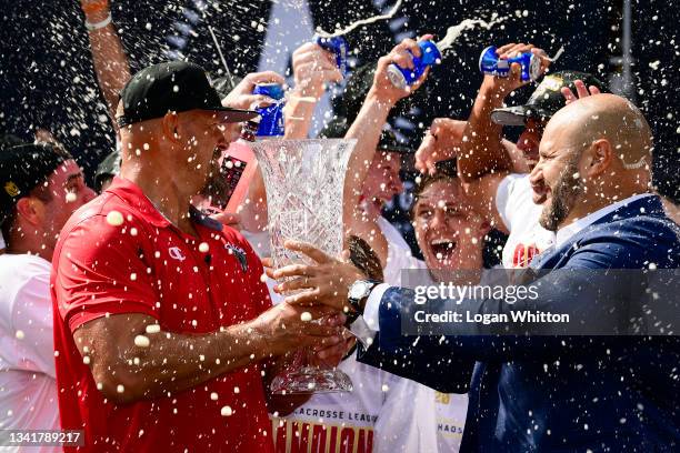 Head Coach Andy Towers of Chaos Lacrosse Club accepts the championship trophy from league co-founder Michael Rabil after defeating Whipsnakes...