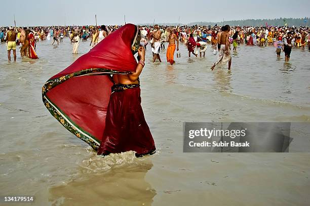 indian veiled woman in red sari - pilgrim stock pictures, royalty-free photos & images