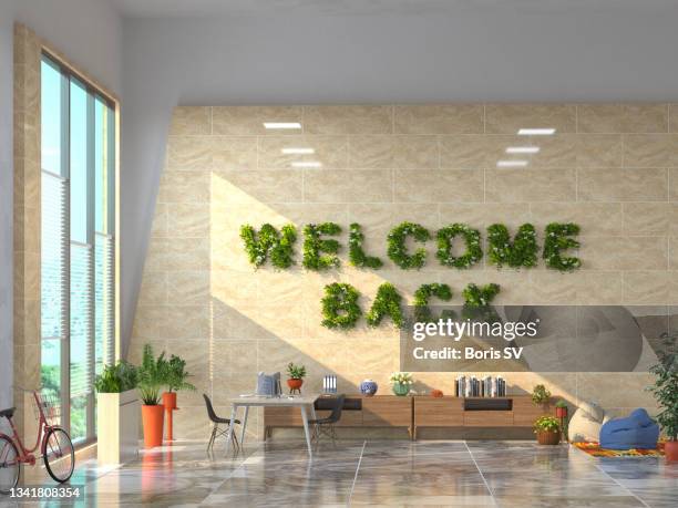 welcome back greeting on the wall - vertical garden stock-fotos und bilder