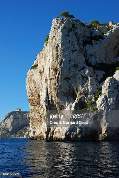 huge rock in mediterranean sea - bernard grua stock pictures, royalty-free photos & images