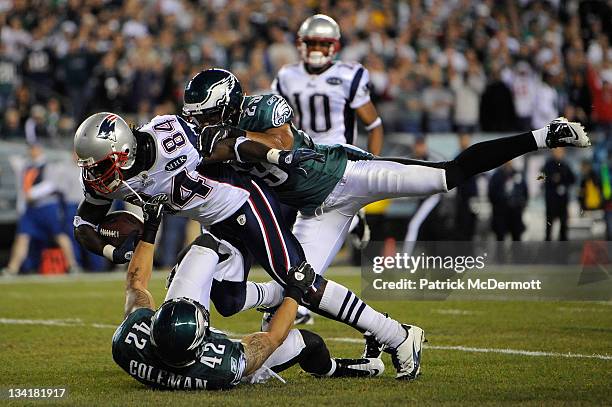 Deion Branch of the New England Patriots catches a 63-yard reception in the second quarter against Kurt Coleman and Nate Allen of the Philadelphia...