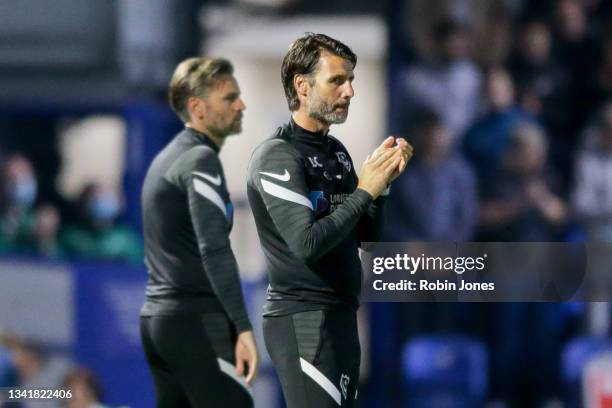 Head Coach Danny Cowley of Portsmouth FC claps on the 10 minute mark in memory of Sophie Fairall, a young cancer sufferer who died earlier in the...