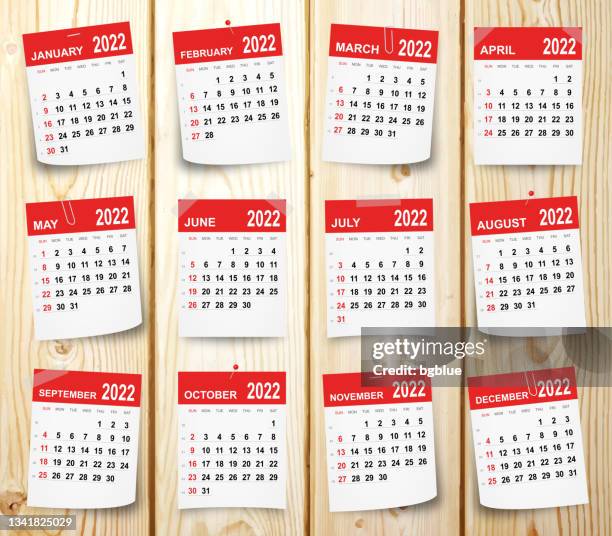 calendar 2022 isolated on wooden background - red push pins stock illustrations
