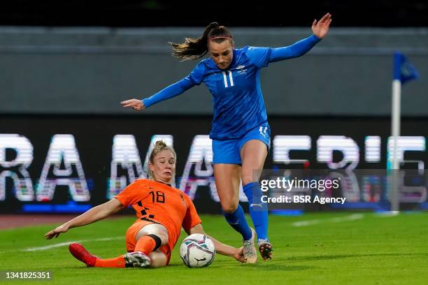 Sisca Folkertsma of the Netherlands and Hallbera Gisladottir of Iceland during the 2023 FIFA Women's World Cup Qualifying Round Group C match between...