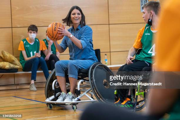 Sandra Riess and kids of the Bavarian disabled school for children playing wheelchair basketball during the Photocall for the tv show...